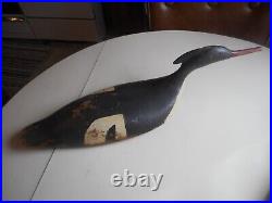 A pair of early 20th Century hand carved and painted Merganser Decoys. Decoy
