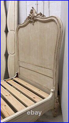 Matched pair of Vintage French single beds carved painted