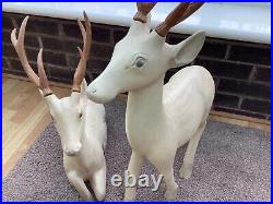 PAIR OF LARGE WOODEN DEER one standing and one sitting