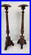 Pair of antique hand carved wooden candlestick holders used in church alter